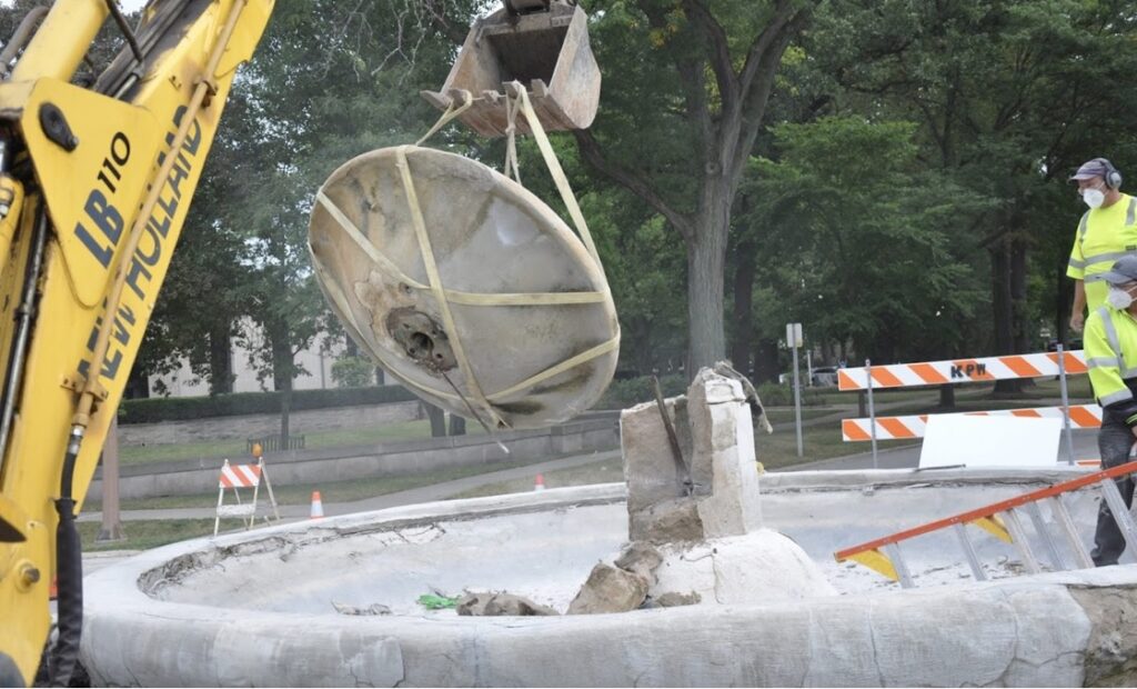Demolition of original limestone fountain