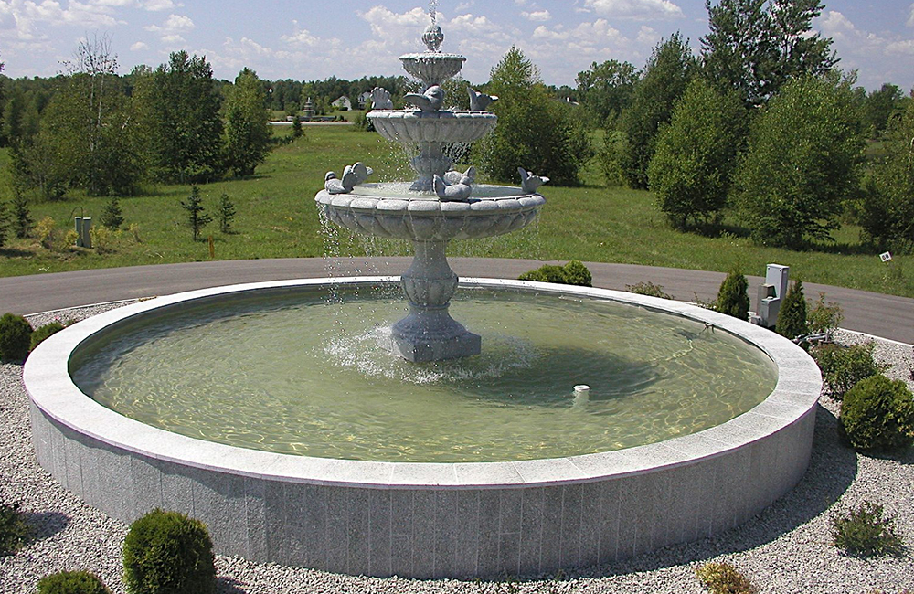 3-tier Bird Fountain carved of Bianco Catalina granite in Lake Sandia Sub Division in Krakow, WI