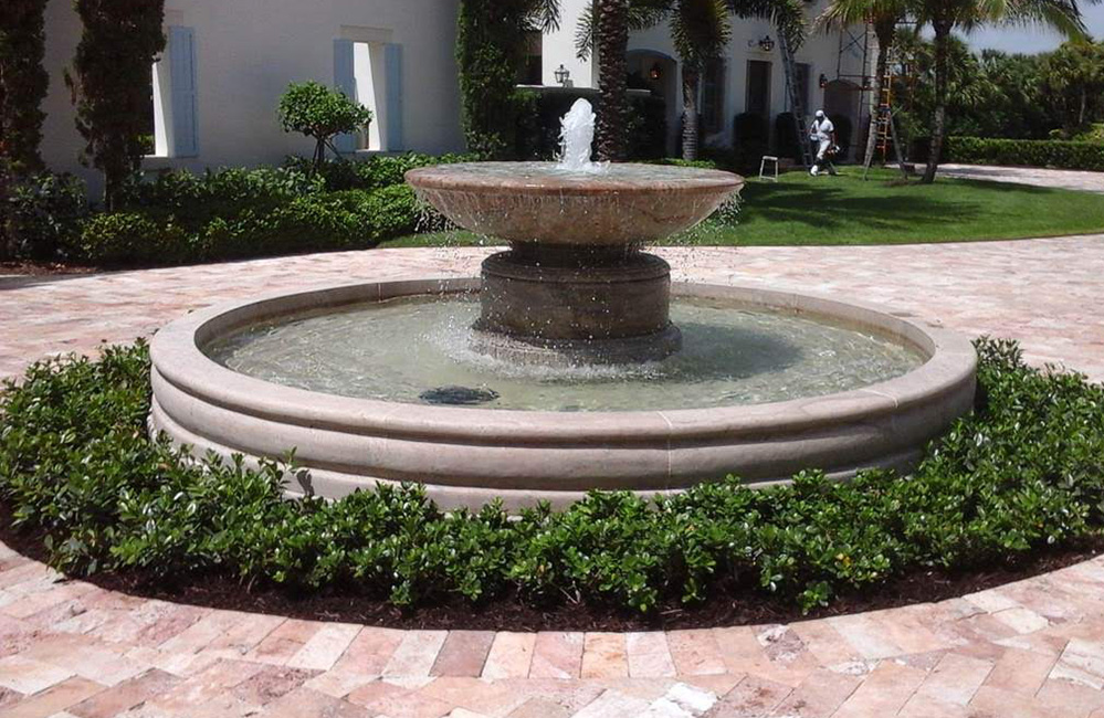 60 Inch Diameter Urn fountain in a 12 Foot Diameter Tuscan Pool Surround, carved of Cabo Sands Granite