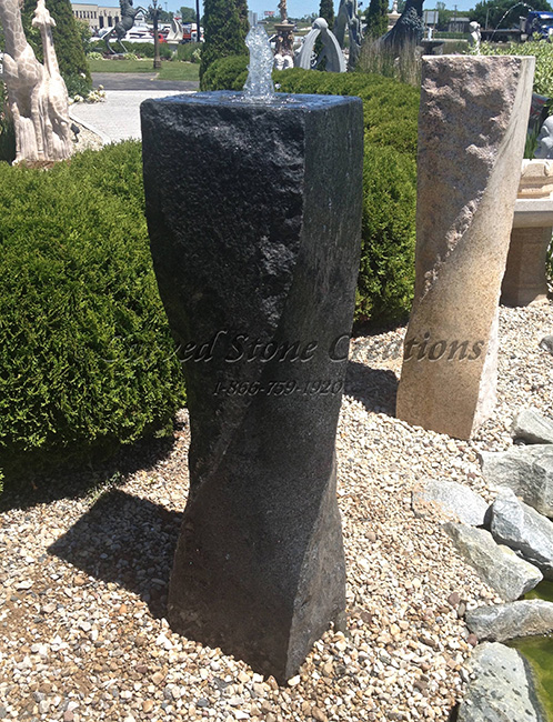 Charcoal Grey Granite Twist Fountain in a Disappearing Fountain installation.