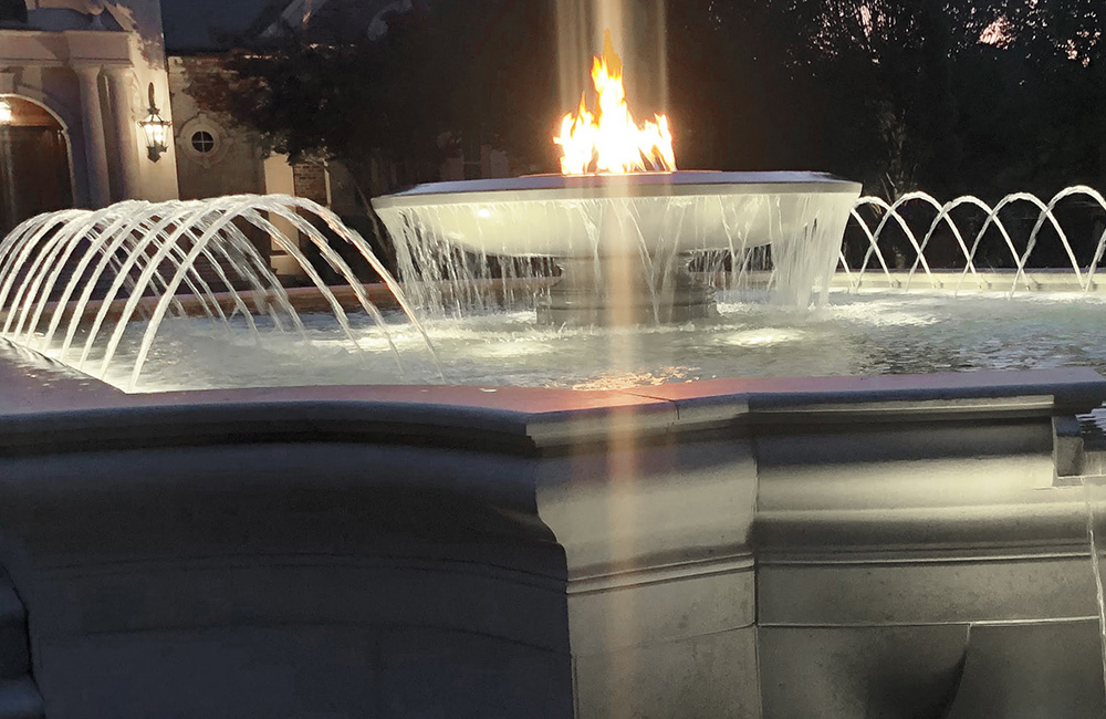 Large Cascading Firebowl Fountain, carved of Golden Cypress Granite.