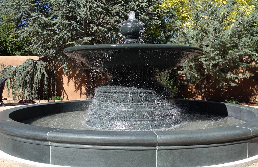 96 Inch Diameter Urn Fountain in a 15 Foot Custom Pool Surround, carved of Green Granite.