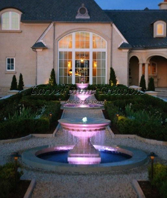 Three Urn fountains carved of Golden Cypress Granite, lit with colored UW LED Lights.