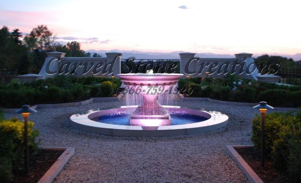 Urn fountain carved of Golden Cypress Granite, lit with colored UW LED Lights.